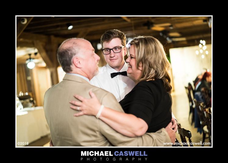 Groom and parents dance